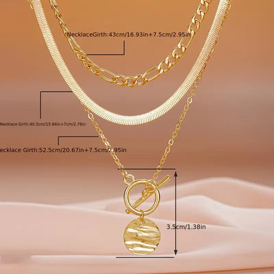 Огрлица Савира са текстурираним новчићима и слојевима | Злато