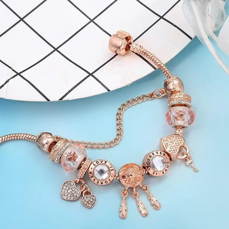 Наруквица хватача снова са ружом и привесцима од стерлинг сребра