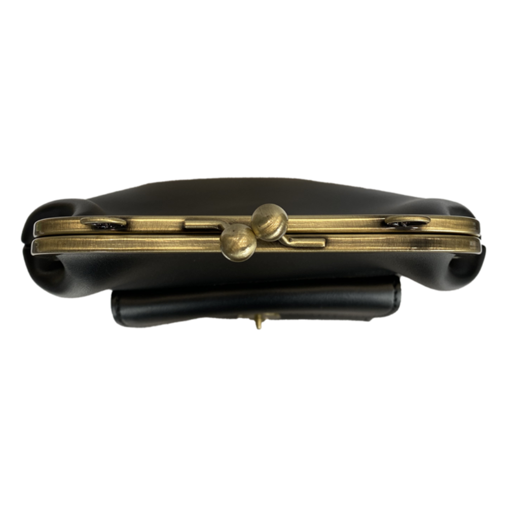 Винтиџ Kiss-Lock торба – неопходан модни детаљ у ретро стилу